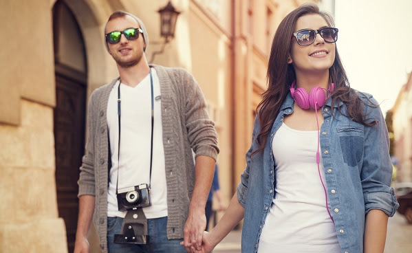 Stylish couple walking in the city